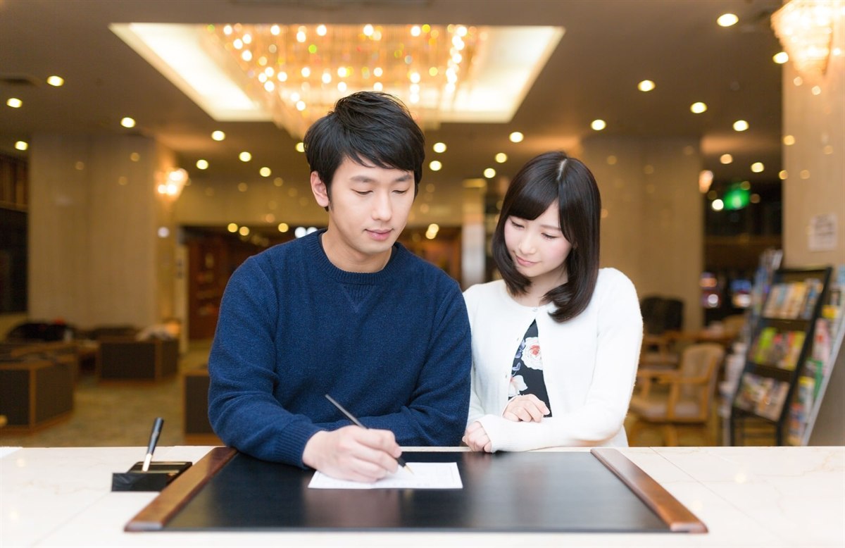 Checking in at a hotel front desk in Japan.