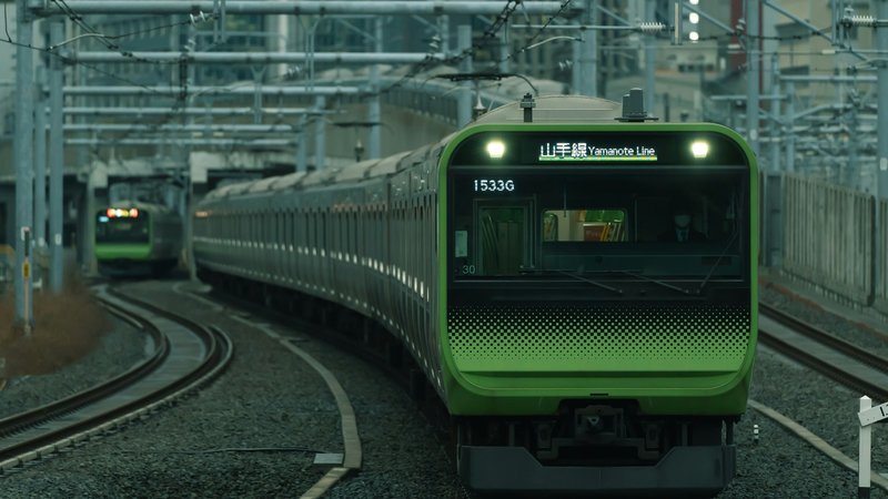 A Yamanote Line train arriving at the platform