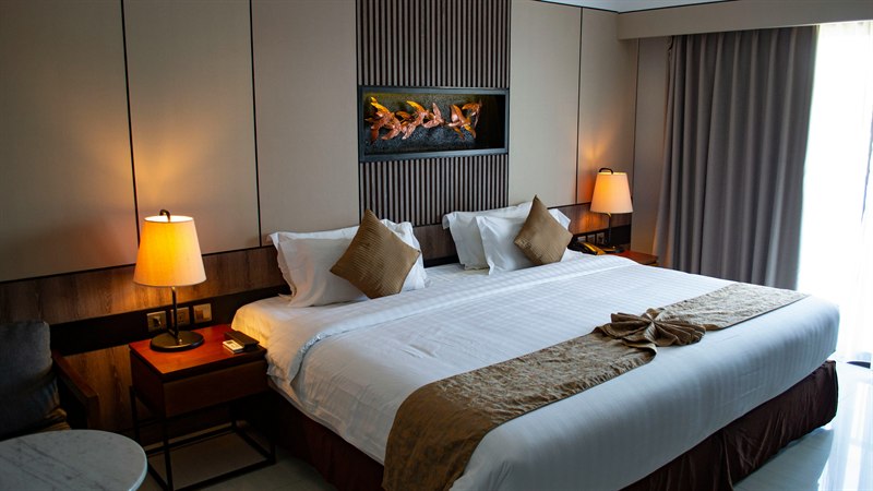 A made-up hotel bed in a Tokyo hotel room